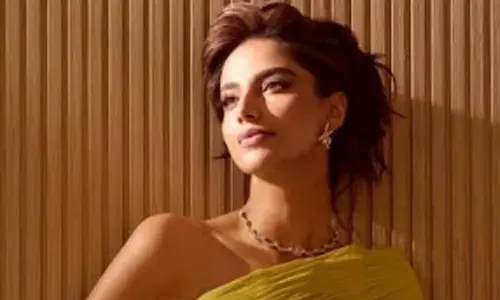 Meenakshi Chaudhary sets internet ablaze in a mustard trail gown