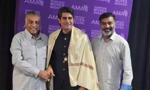 VHP chief felicitates AMA president Bobby Mukkamala