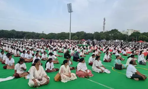 Yoga Enthusiasts Gather at Tatipudi Reservoir for Yogandhra Event