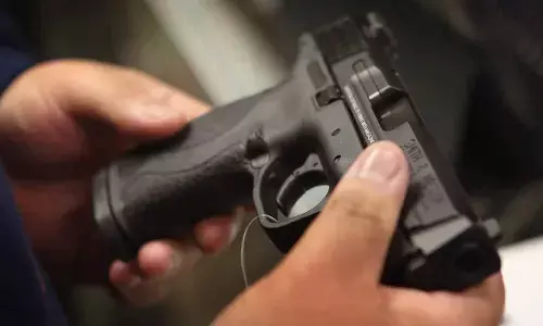 Supervisor threatens workers with toy pistol