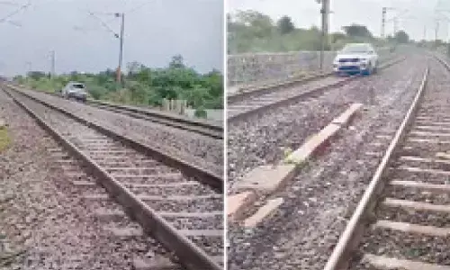 Tipsy woman drives car on rly track; train services disrupted