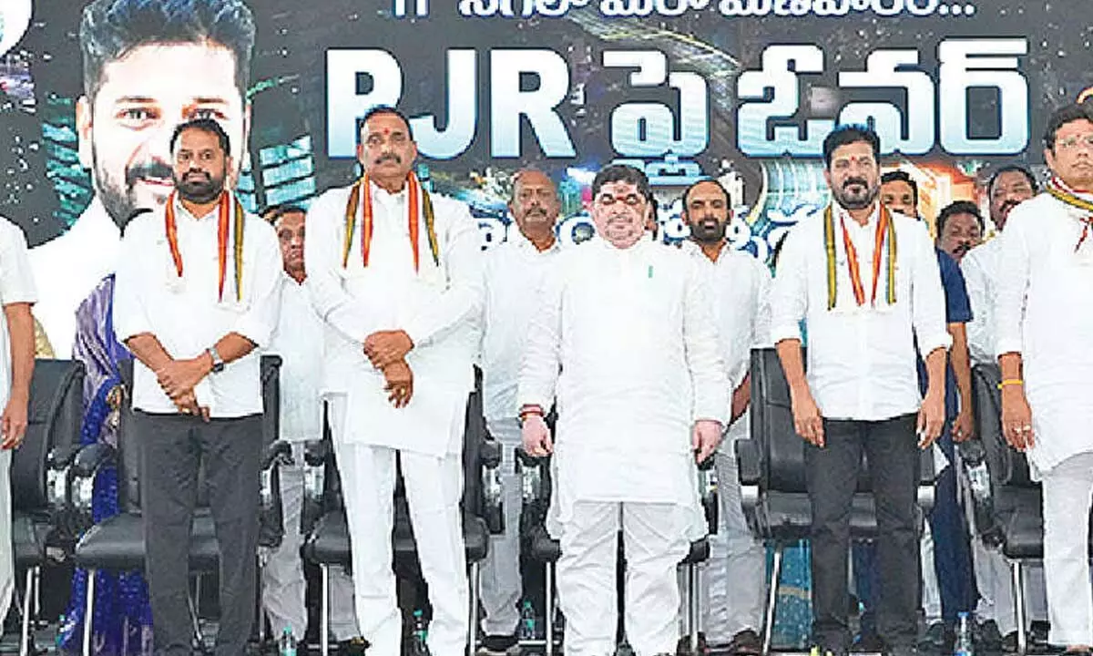 Chief Minister A Revanth Reddy along with the ministers and other dignitaries after inagurating the PJR flyover in Hyderabad on Saturday Chief Minister A Revanth Reddy along with the ministers and other dignitaries after inagurating the PJR flyover in Hyderabad on Saturday