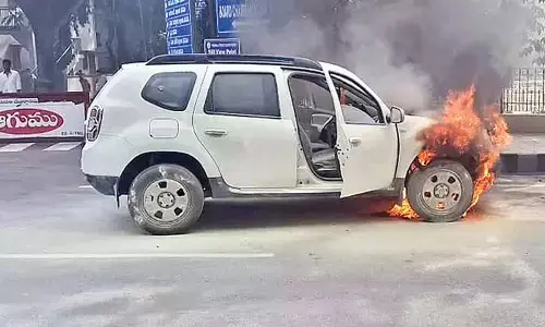 Fire guts car near Tirumala toll gate