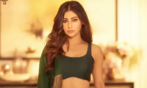 Mouni Roy strikes in bold green ensemble