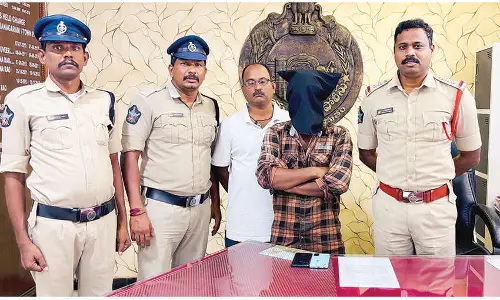 Man held for allegedly trying to film a woman in bathroom