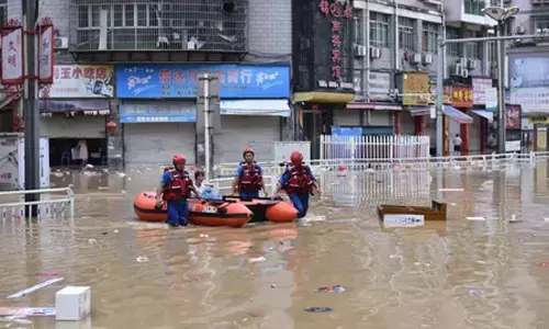 Beijing issues blue alert for rainstorms