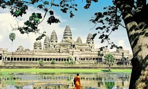 Archaeologists restoring ninth brick tower of Bakong temple in Cambodias famed Angkor park