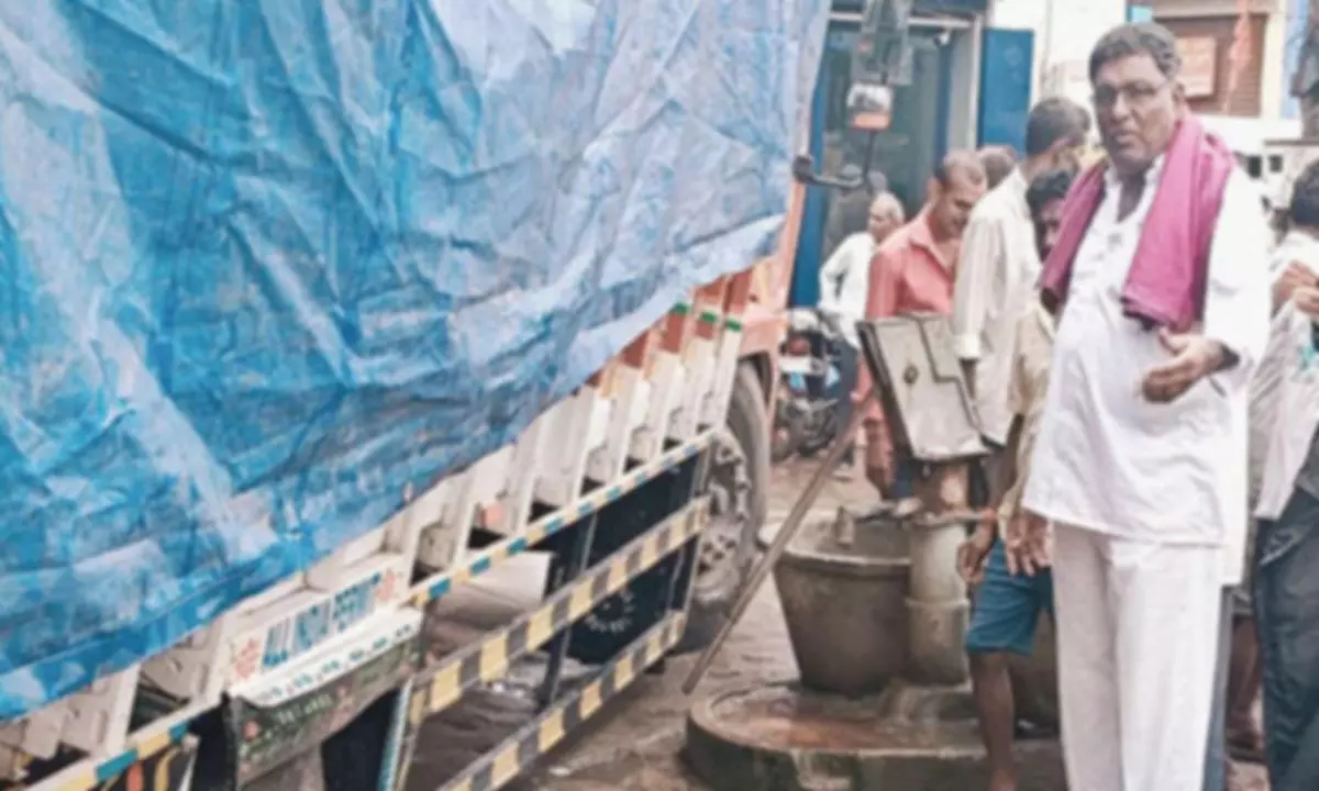 Mini lorry gets stuck in damaged drain