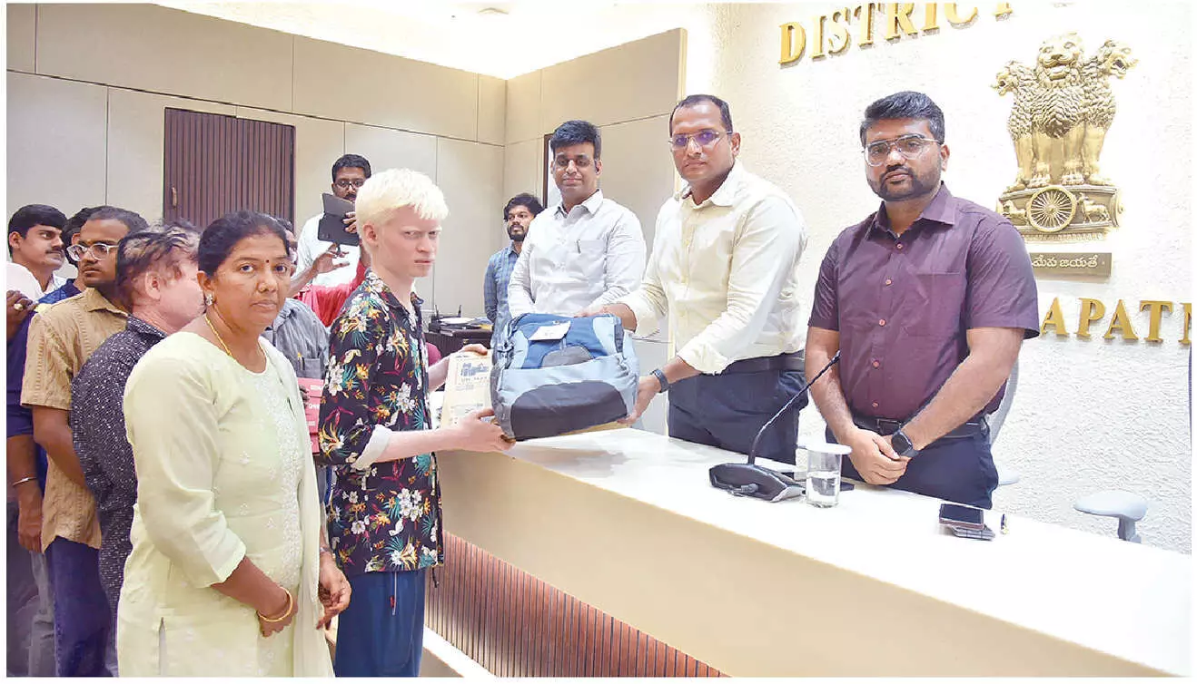 Physically-challenged persons receive laptops