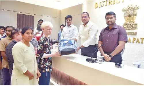 Physically-challenged persons receive laptops