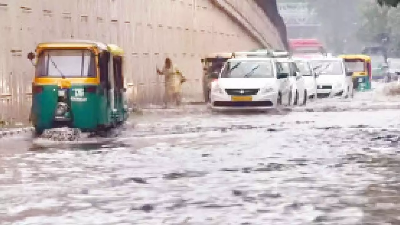 Rain triggers traffic jams across Delhi Rain triggers traffic jams across Delhi
