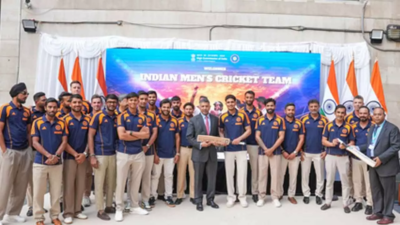 An evening to remember: Gill & Co. present signed bat to Indian High Commissioner in London