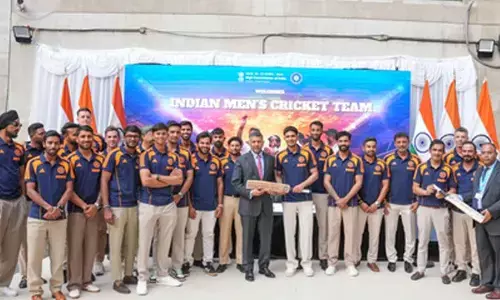 An evening to remember: Gill & Co. present signed bat to Indian High Commissioner in London