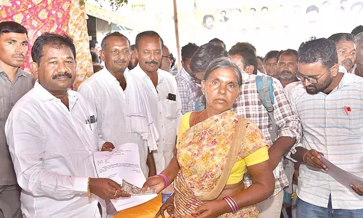 Minister distributes pensions Minister distributes pensions