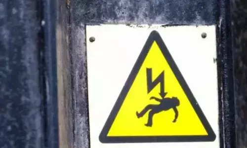 Two die of electric shock while replacing advertising board