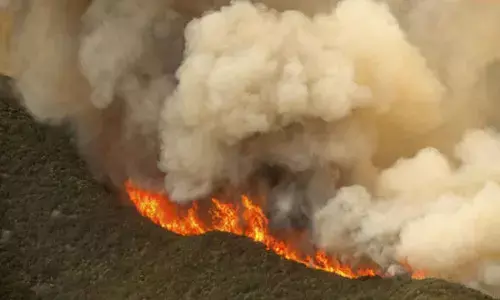 Massive wildfire in central California threatens homes, injures 3 people as it burns out of control