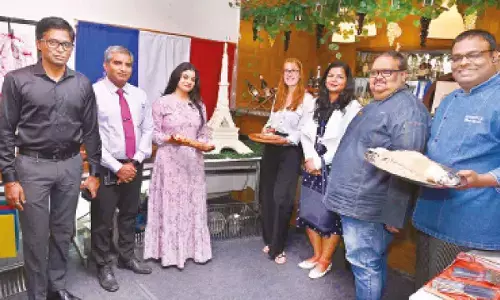 Connoisseurs regaled at French-themed luncheon