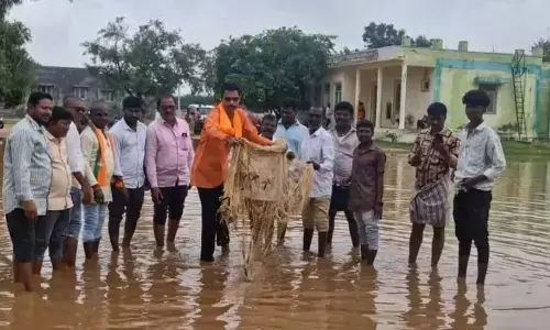 BJP Stages Unique Protest at Aija PHC — Fishing Nets Cast in Stagnant Water to Expose Negligence