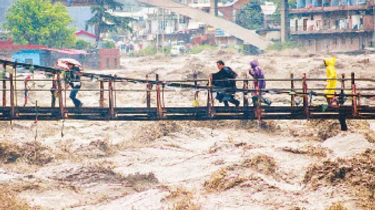 Three shops, bridge washed away by flash floods in Kullu