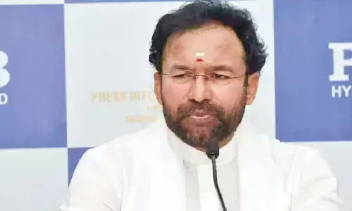 Distributes notebooks, shoes to govt school students