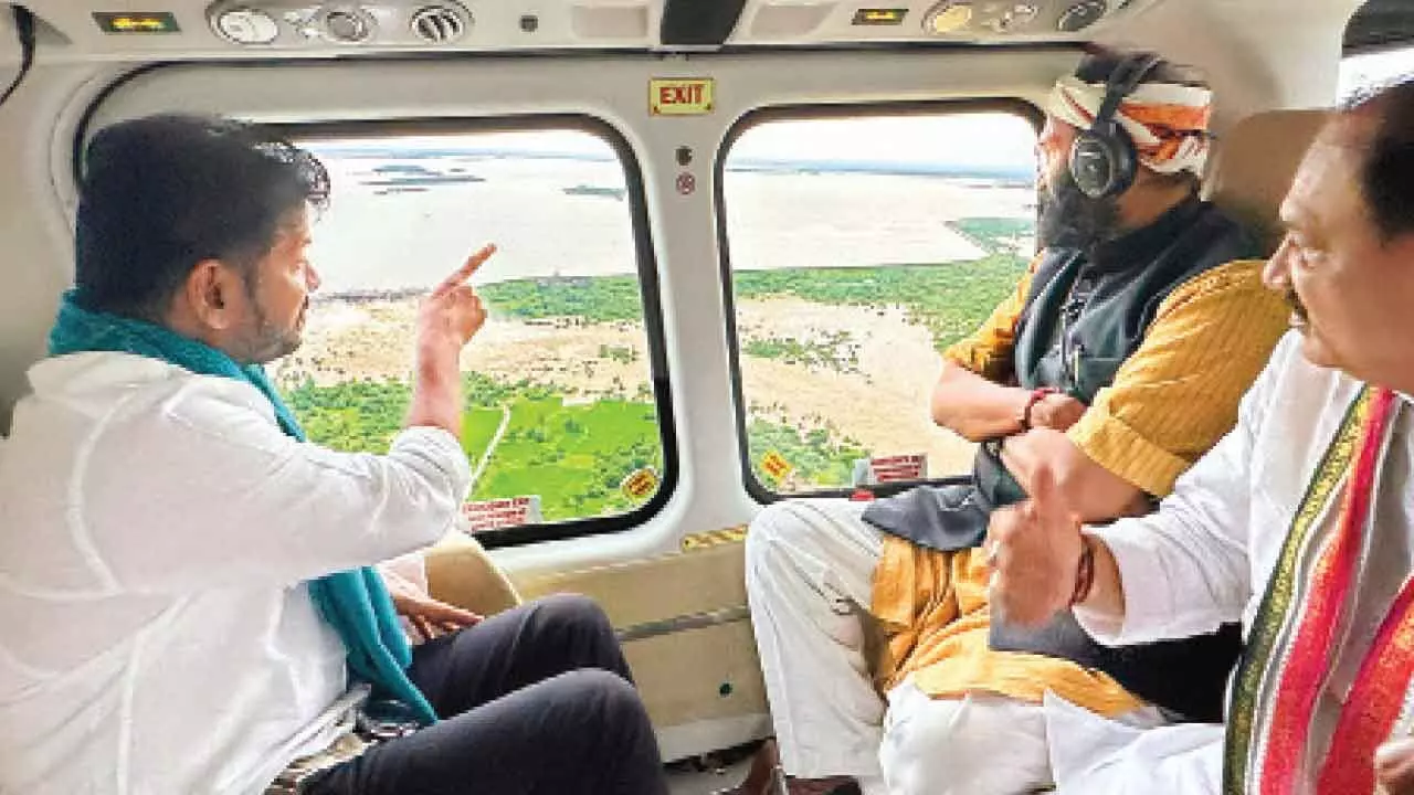 Revanth makes aerial survey of affected areas Revanth makes aerial survey of affected areas