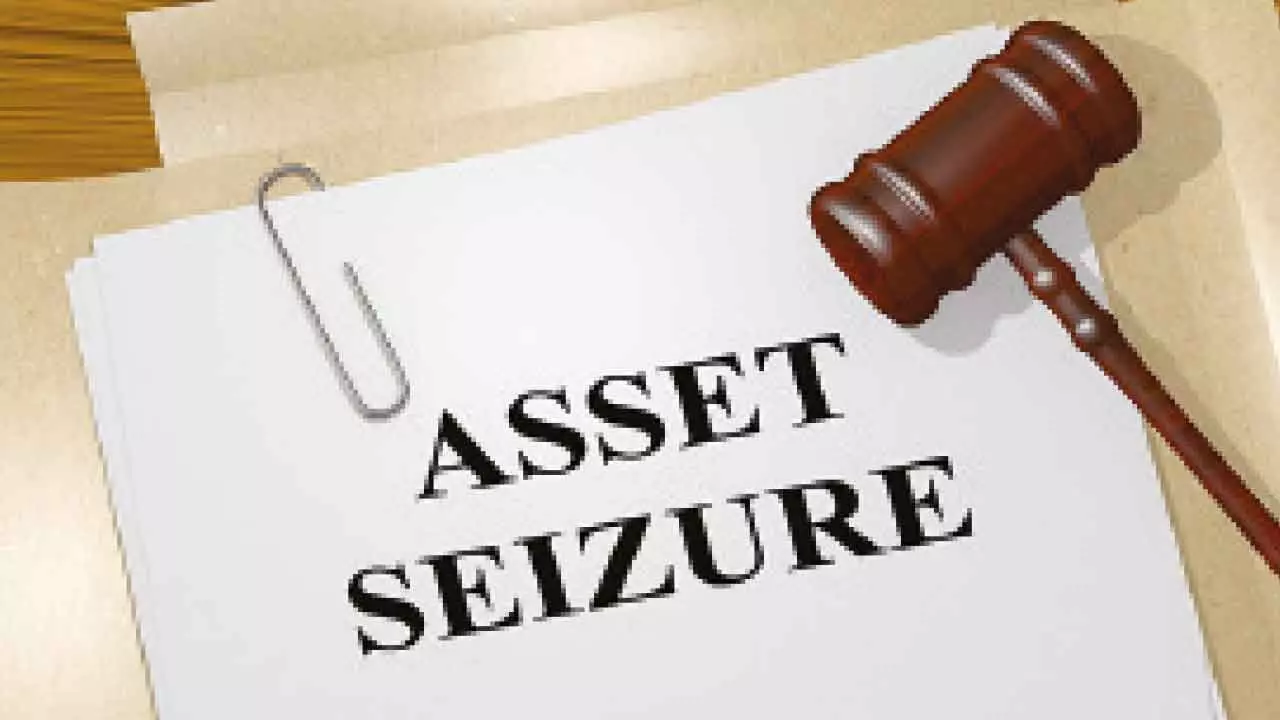 2 cops, builders booked for property seizure