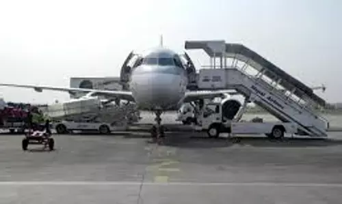 Flights from Kathmandu airport restart 24 hours after violent demonstrations forced a shutdown.