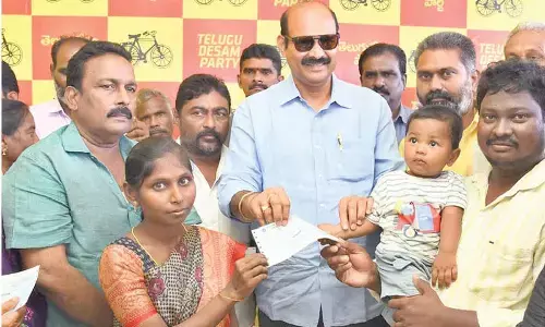 MINISTER Parthasarathy distributes CMRF cheques