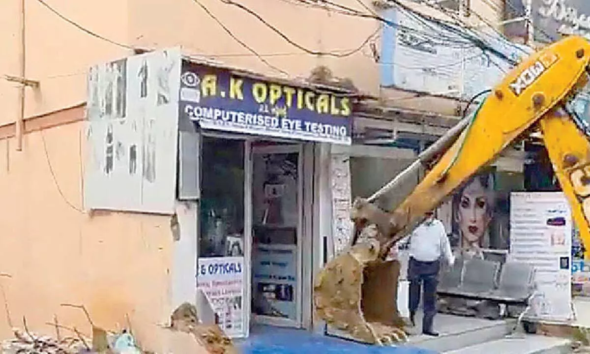 GHMC demolishes illegal encroachments on footpaths