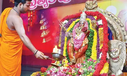 Thousands of devotees pray at Durga temple