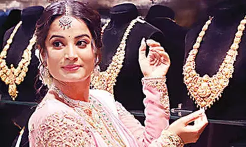 Gold price surges `9,700 to new peak of`1.3 lakh/10gm