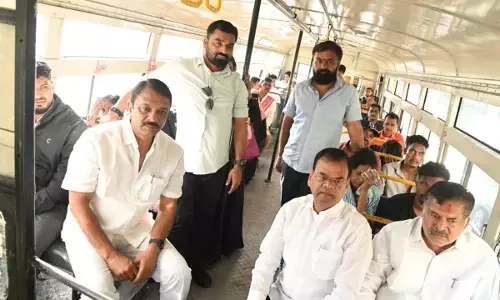 BRS MLAs travel in RTC bus protesting fare hike and demand govt to withdraw the increased fares