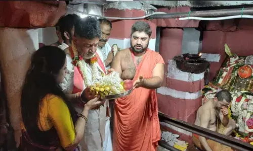 D K Shiva Kumar  says only god and  he know  about becoming  CM, offers prayers at hasanamba temple