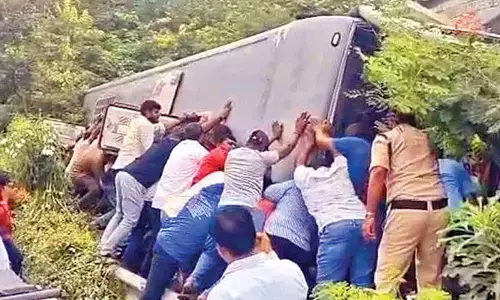 Private bus overturns
