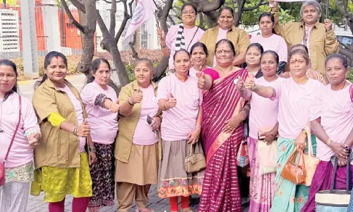 Women bikers and pink autos rally for breast cancer awareness