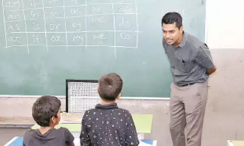 District Collector Anudeep Durishetty testing reading skills of students