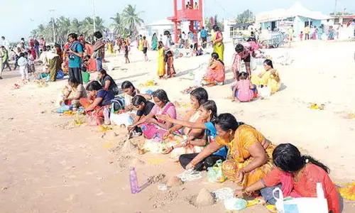 Devotees throng Suryalanka Beach