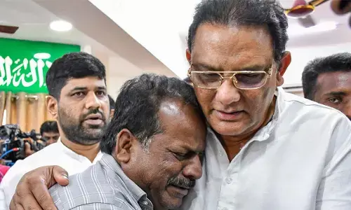 Minority Welfare Minister Mohammad Azharuddin consoles a relative of a victim in Hyderabad on Monday