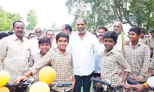 Minister distributes bicycles to students