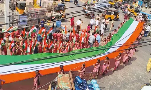 Wow! Students carry 165m long National Flag in rally