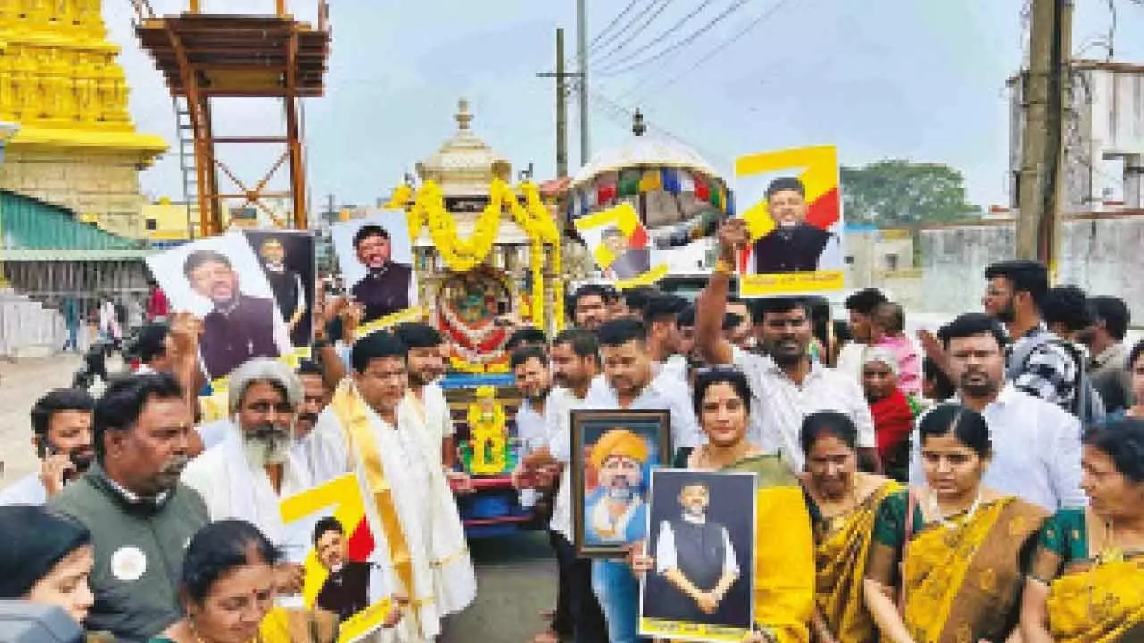 DKS supporters pull silver chariot at Chamundi Hills DKS supporters pull silver chariot at Chamundi Hills
