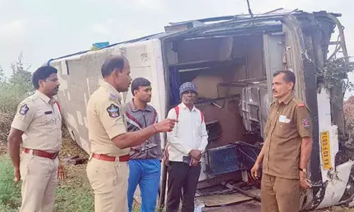 Pvt bus skids into field, 2 injured