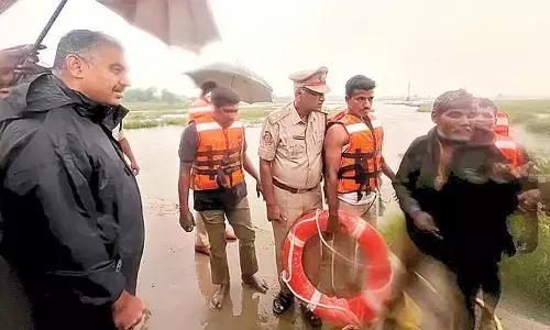 Police, fire teams save man in Swarnamukhi river