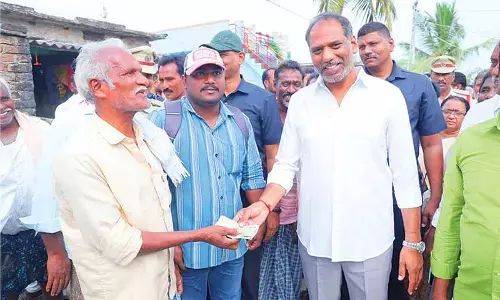 Minister distributes pensions, bicycles