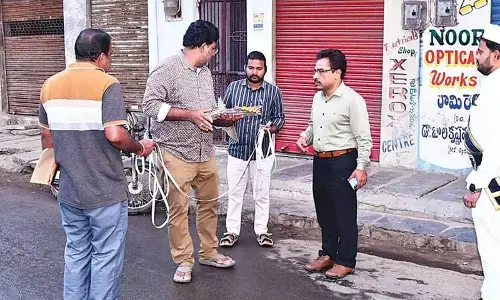 Civic commissioner reviews road widening proposals