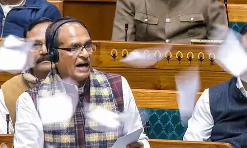 Union minister Shivraj Singh Chouhan speaks in the Lok Sabha as Opposition members throw papers in protest on Thursday Union minister Shivraj Singh Chouhan speaks in the Lok Sabha as Opposition members throw papers in protest on Thursday