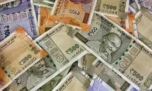 Rupee appreciates 54 paise to close at 89.66/$