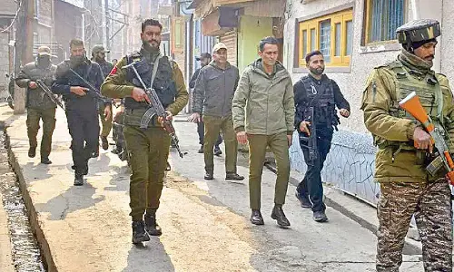 Searches on after terrorists take food from a house