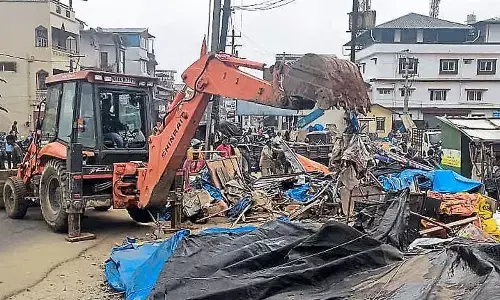 Sakleshpura clears encroached footpaths with JCB operation