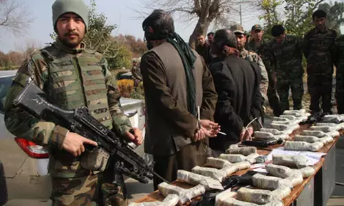 Afghan police confiscate weapons and ammunition cache, arrest suspects